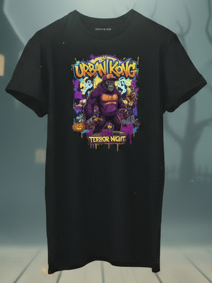 Black t-shirt with a colorful graphic design on a Halloween-themed background with pumpkins and a full moon.