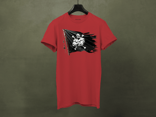 Red t-shirt with a graphic design on a hanger against a green background