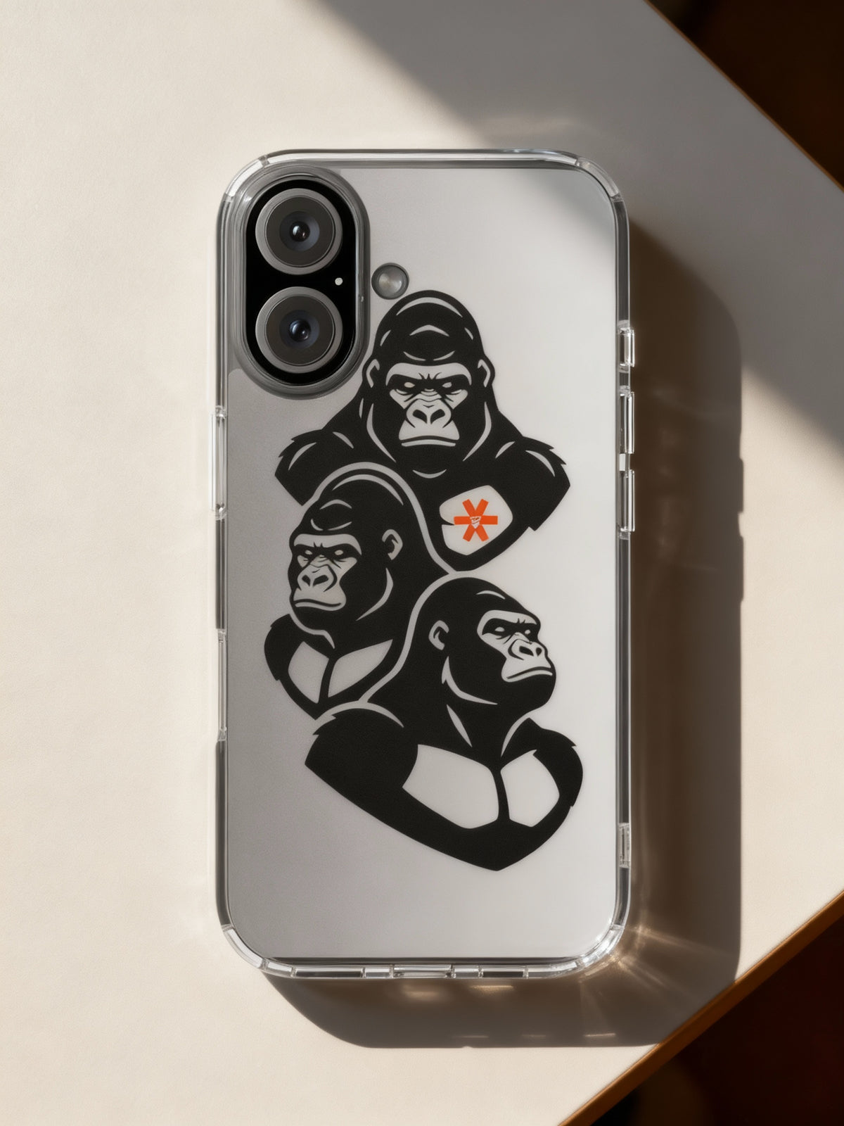 Phone case with gorilla graphic on a light surface