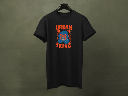 Hanged black streetwear t-shirt with a graphic of vibrant blue cartoon gorilla head, surrounded by red lightning bolts and stars, and the 'URBAN KONG' text in distressed red.