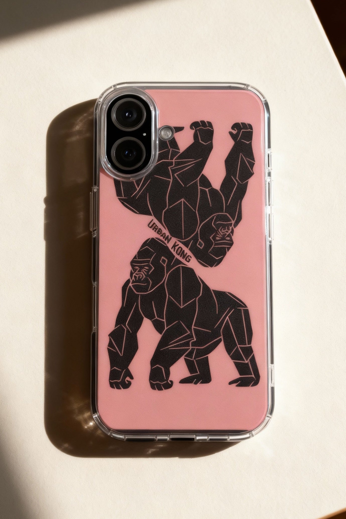 Phone case with geometric gorilla design on a pink background
