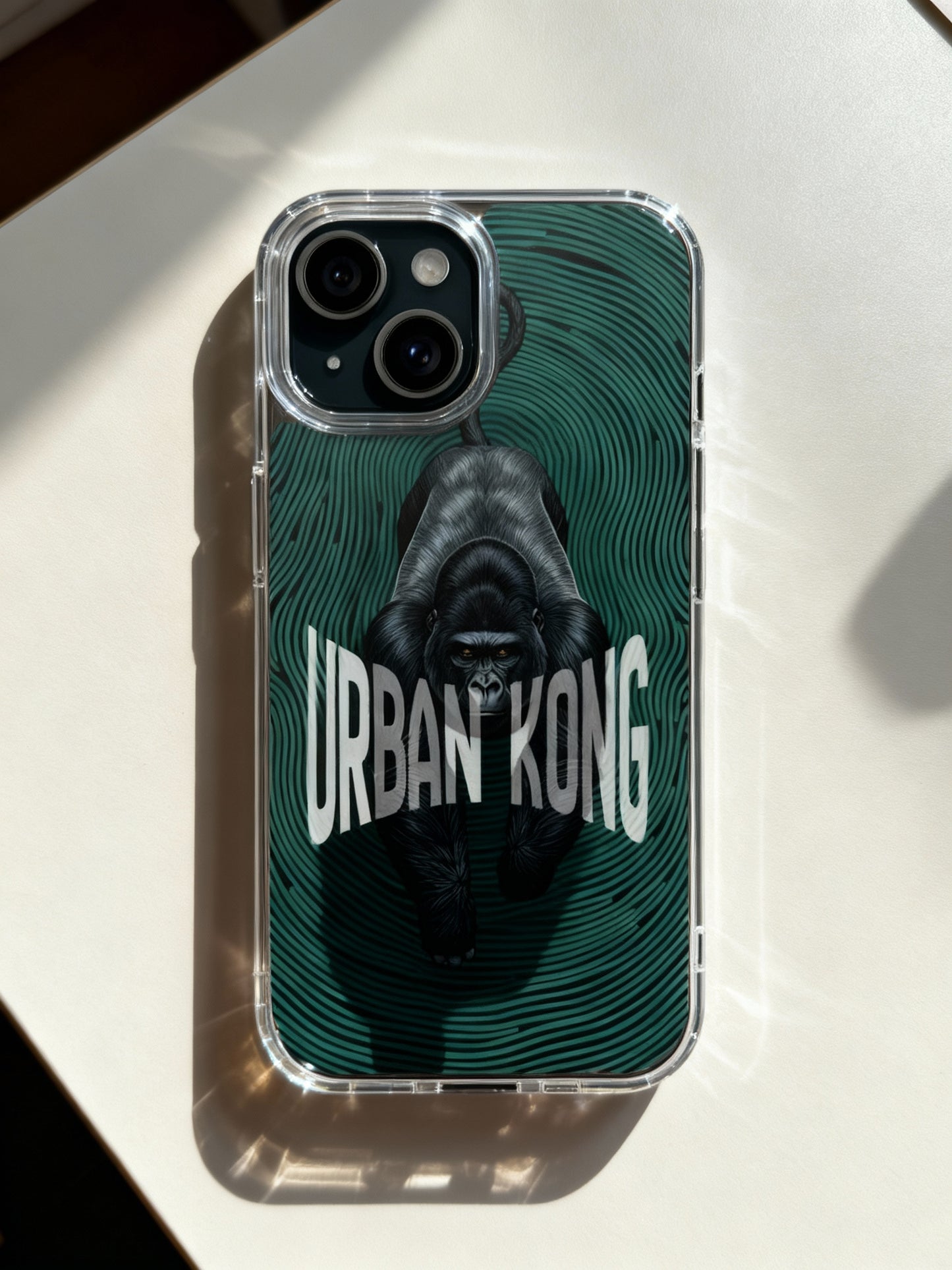 Phone case with gorilla graphic and 'Urban Kong' text on a white surface
