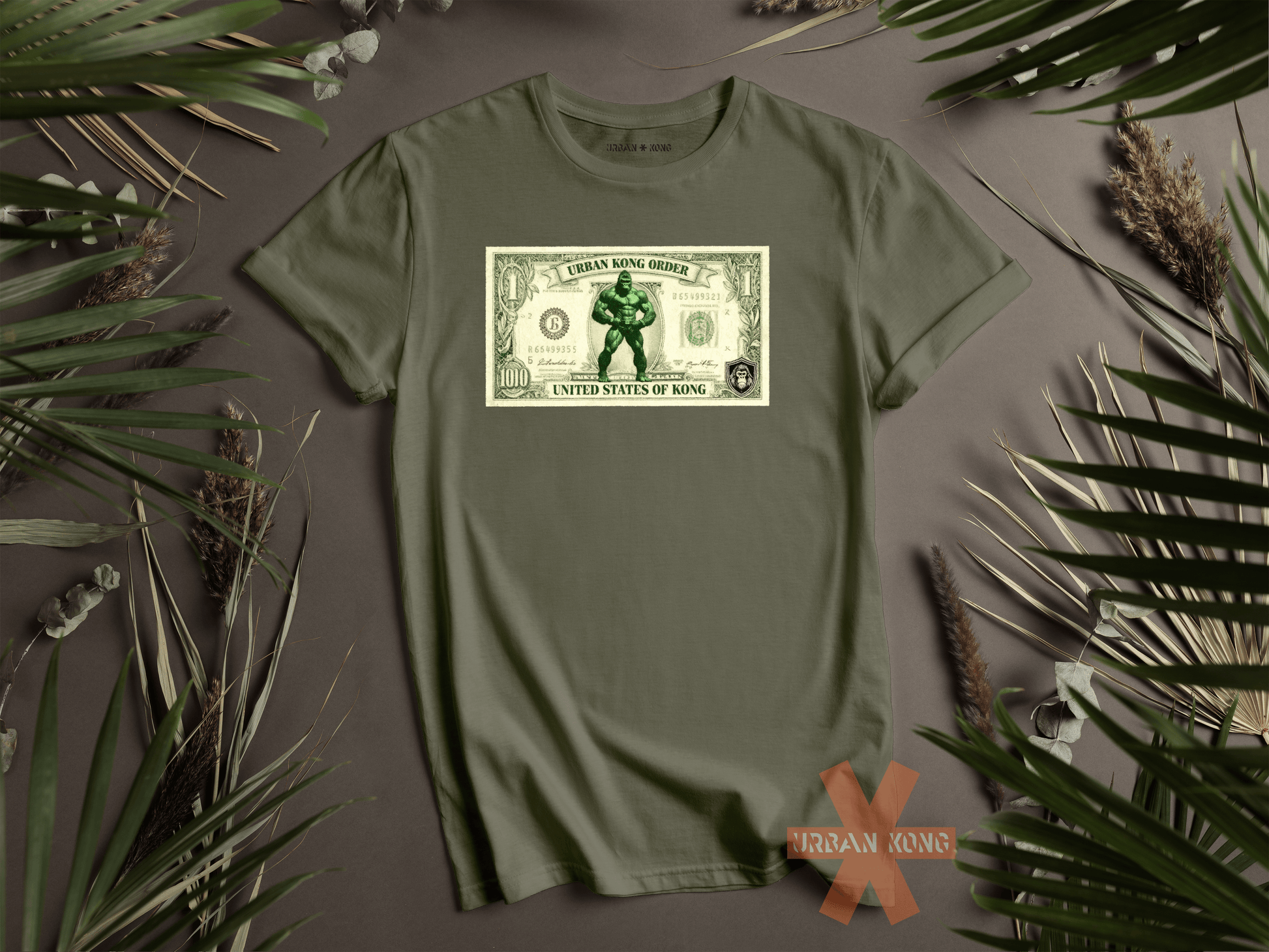 Green t-shirt with a graphic design of a character holding a dollar bill on a gray background with decorative plants.