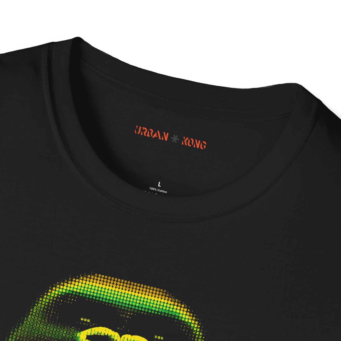Label closeup of black t-shirt featuring a pixelated art gorilla graphic in green, yellow, and red, with the text 'URBAN KONG' below in matching colors.