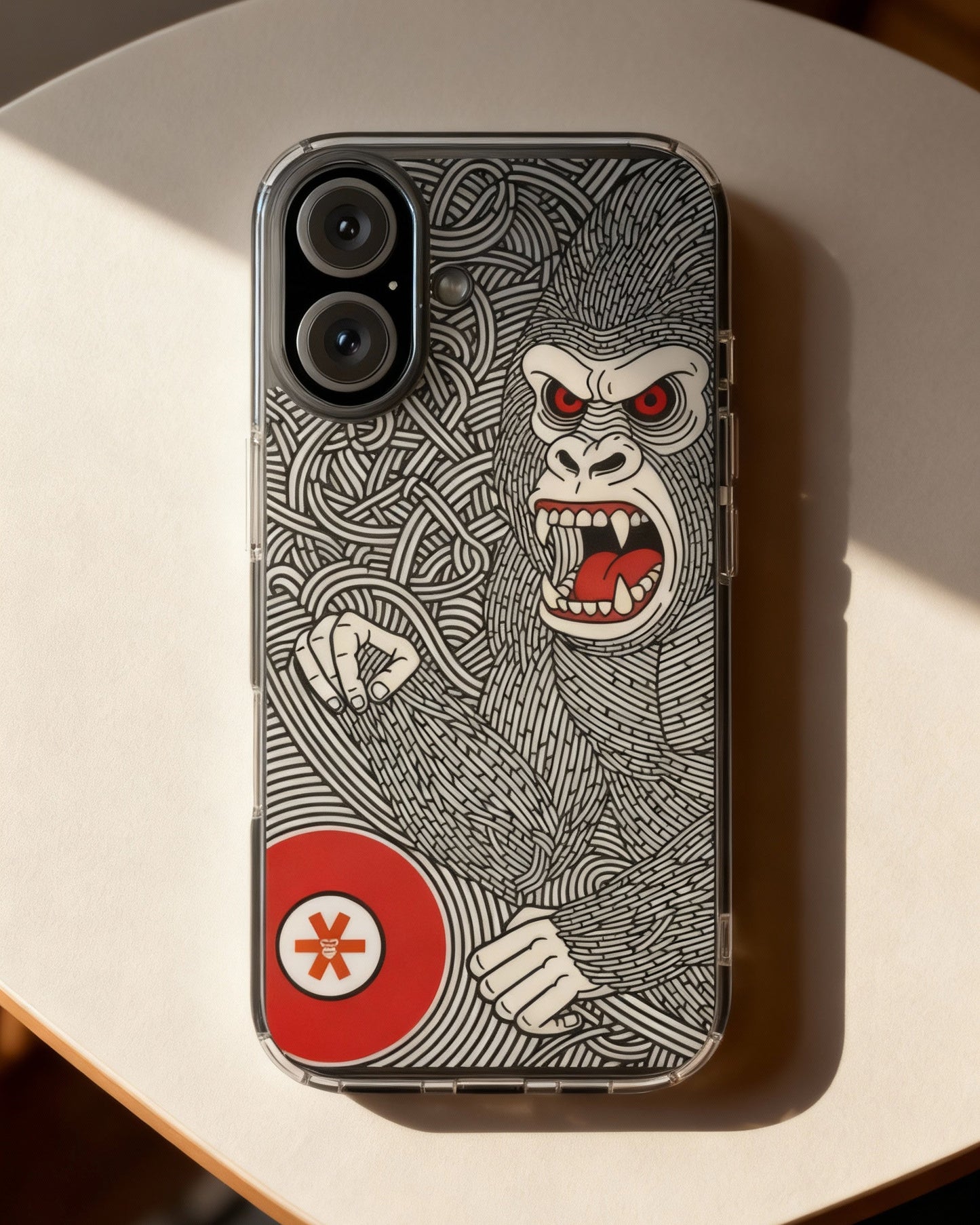 Phone case with a gorilla design on a light surface