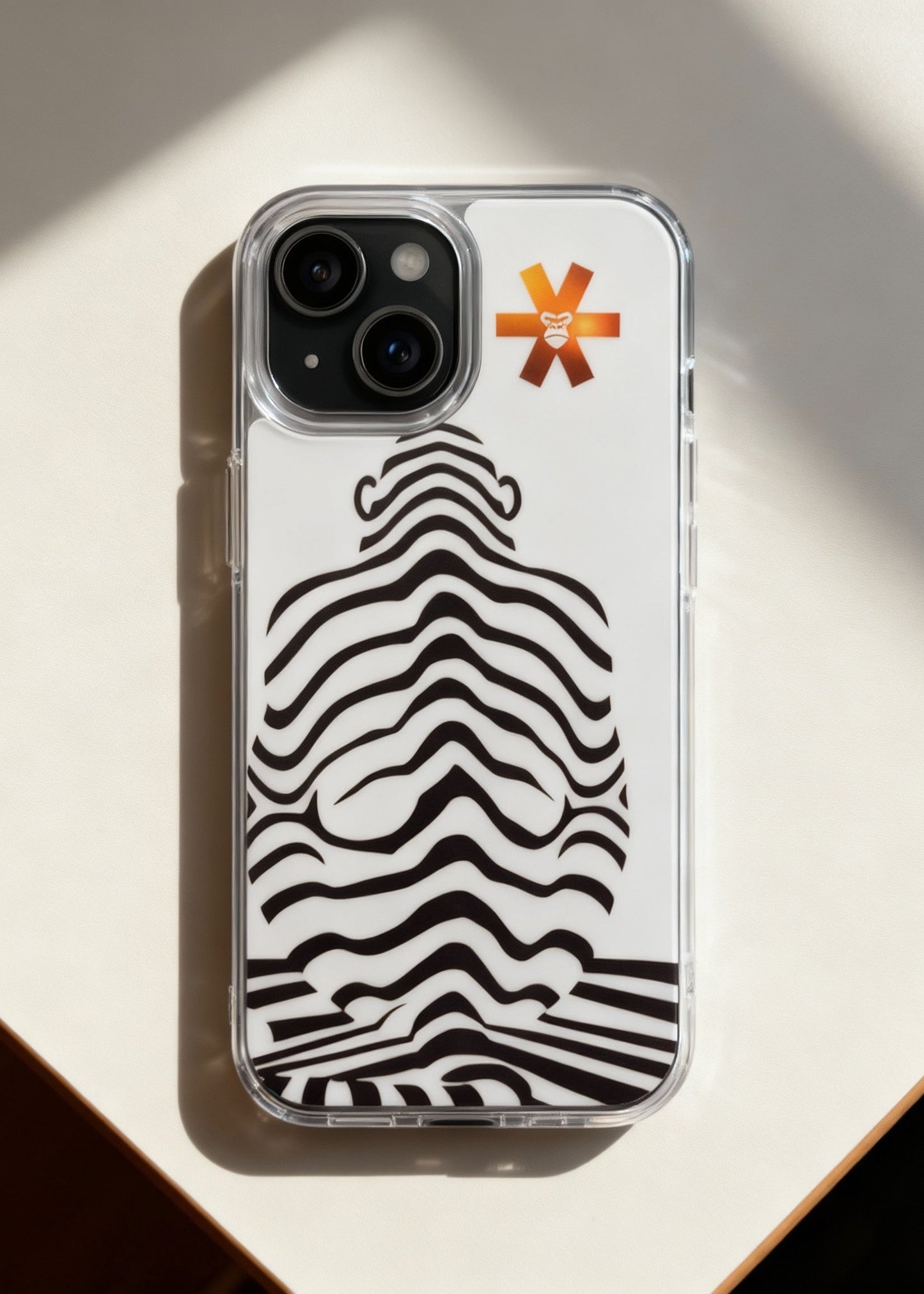 Phone case with zebra pattern and brand logo on a light background