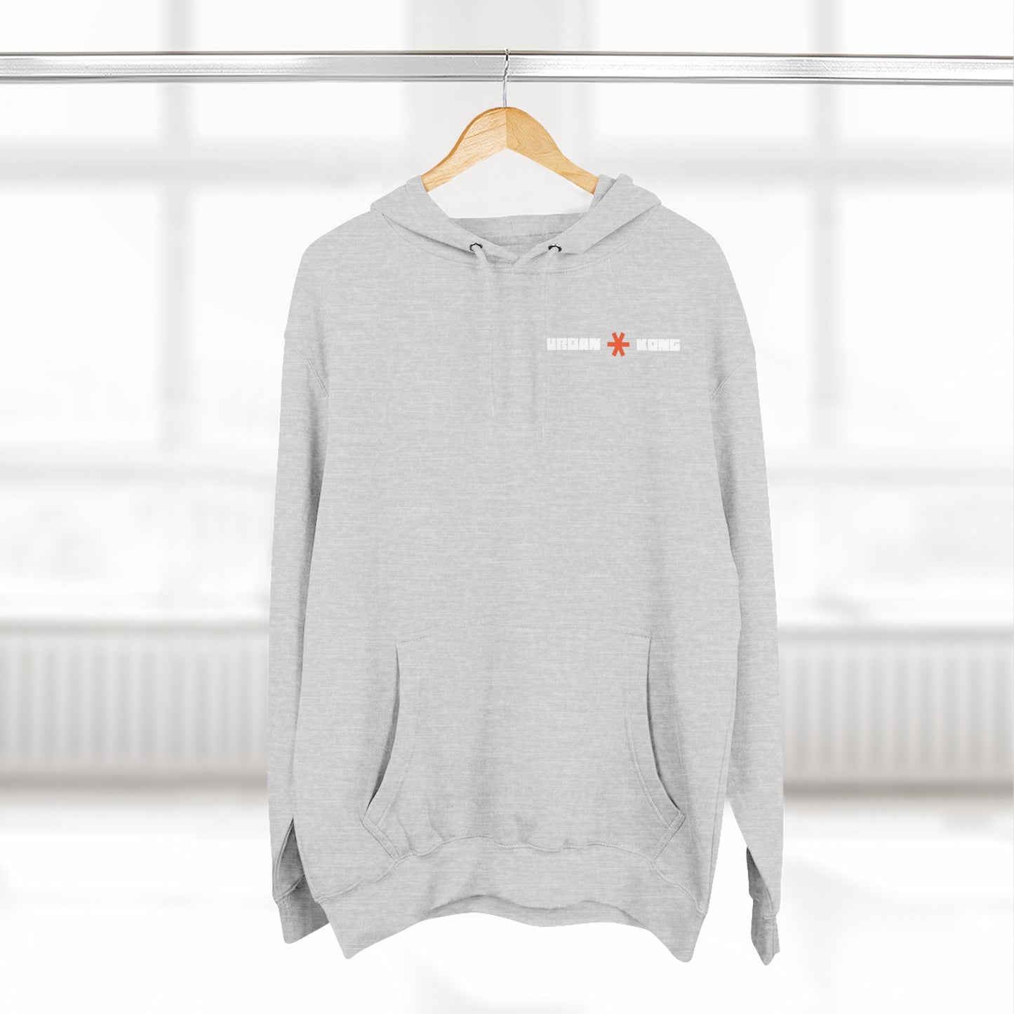 Gray hoodie with a logo on a hanger against a white background
