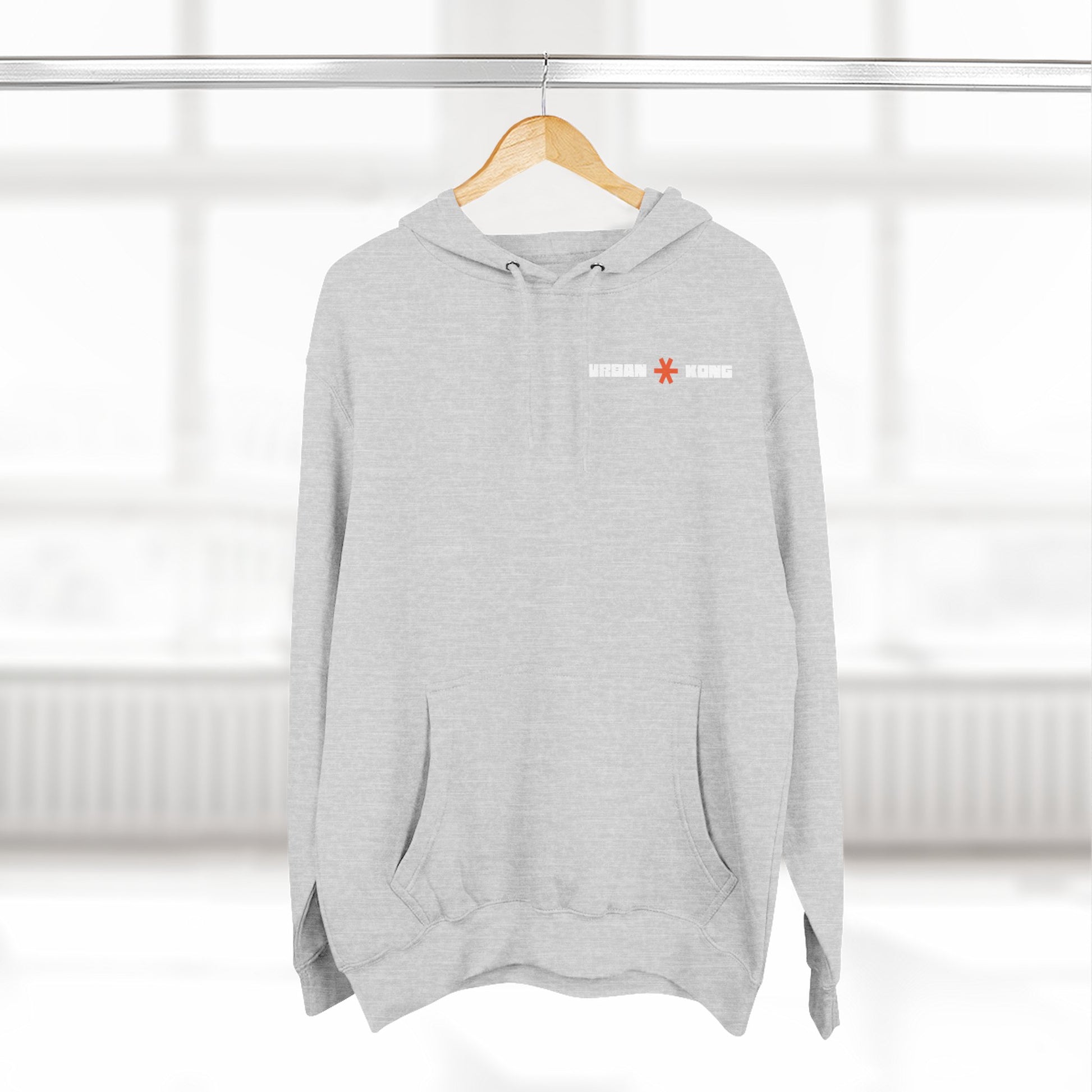 Gray hoodie with a logo on a hanger against a white background