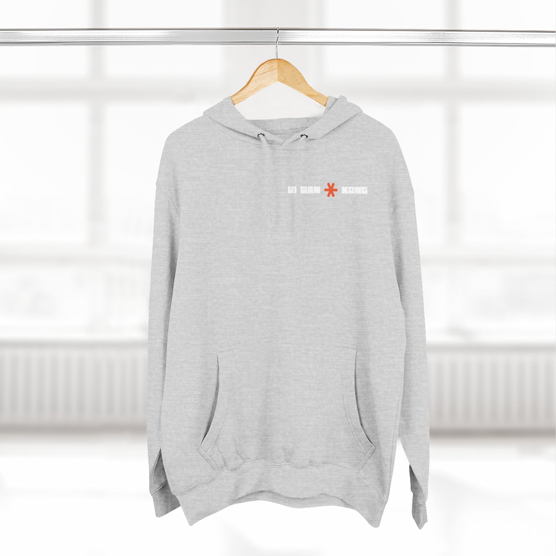 Gray hoodie with a logo on a hanger against a white background