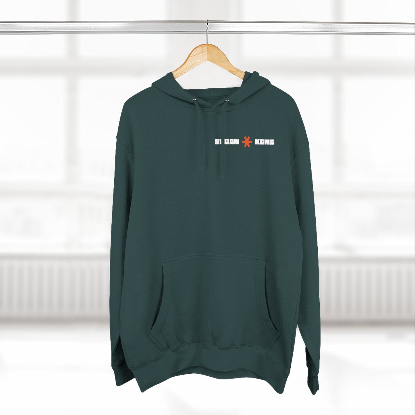 Green hoodie with text on a hanger against a white background