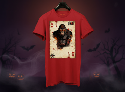 Red t-shirt with a graphic design of a monkey on a card against a Halloween-themed background.