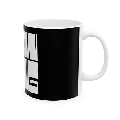 Black mug with white text on a white background