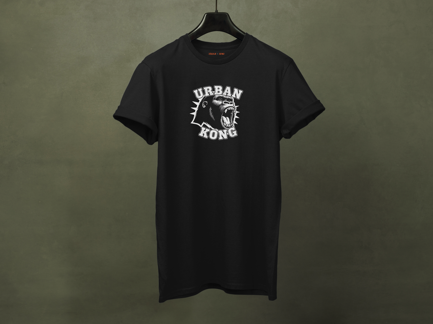 Hanged black streetwear t-shirt with a white  graphic of a roaring gorilla and 'URBAN KONG' text.