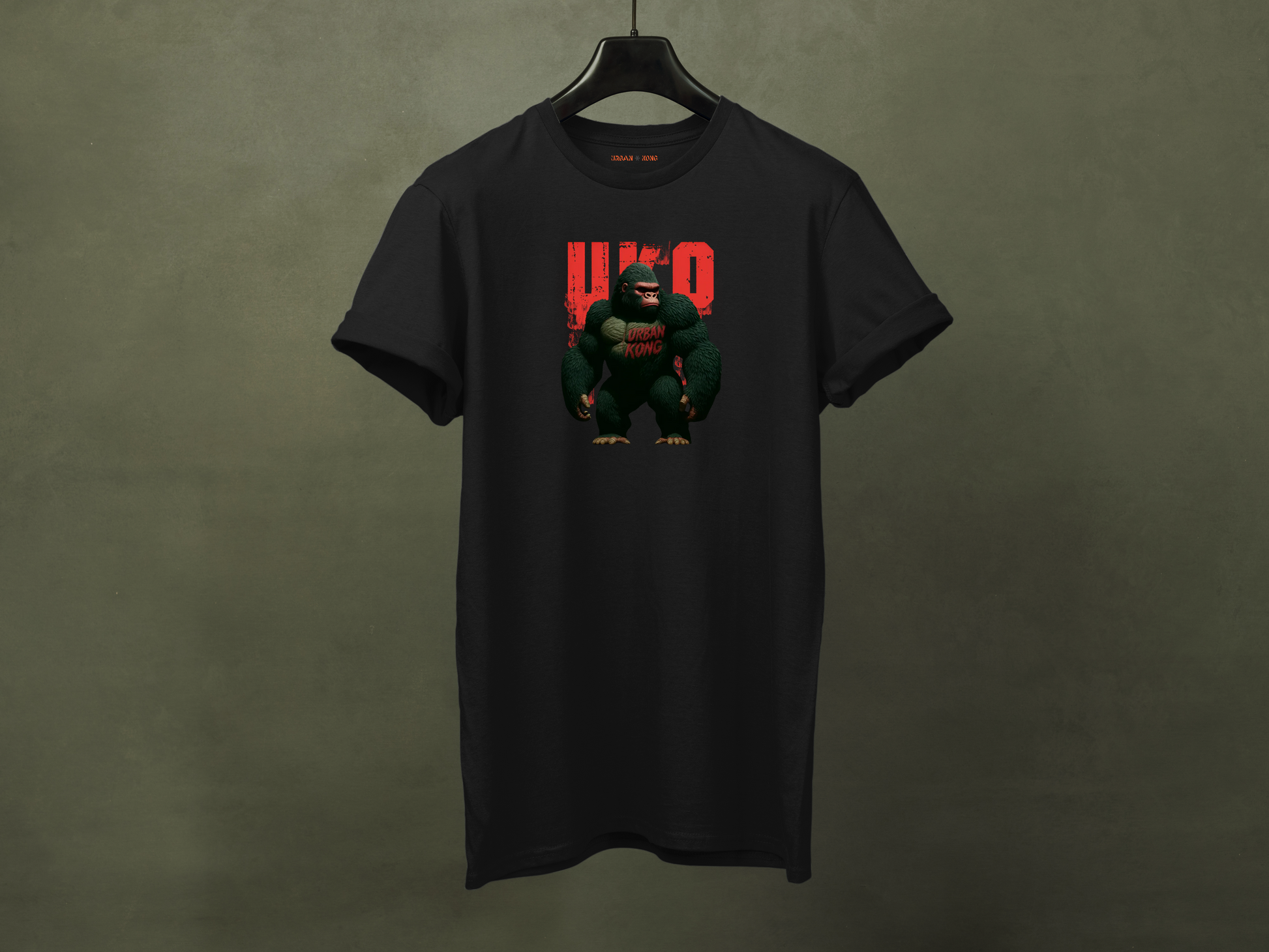 Hanged black streetwear t-shirt with a dark and stylised graphic of a gorilla, featuring red accents and large red 'UKO' text in the background.