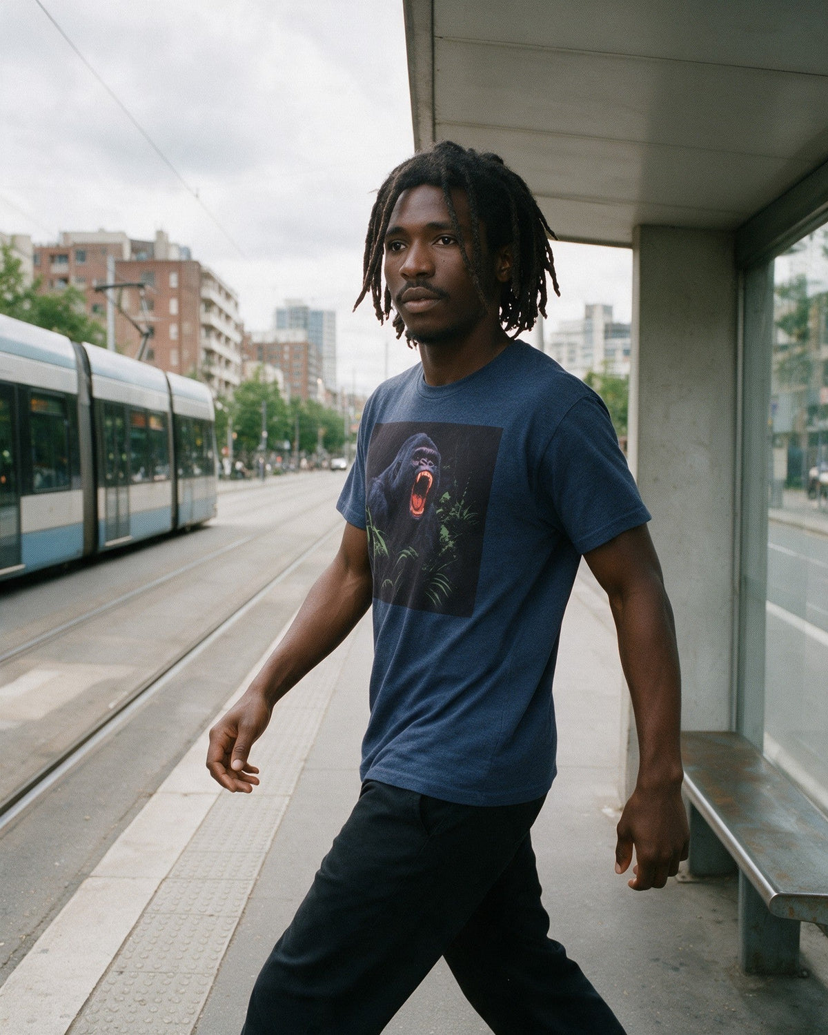 Savage Strength T-Shirt in Heather Navy worn on the street — Urban Kong