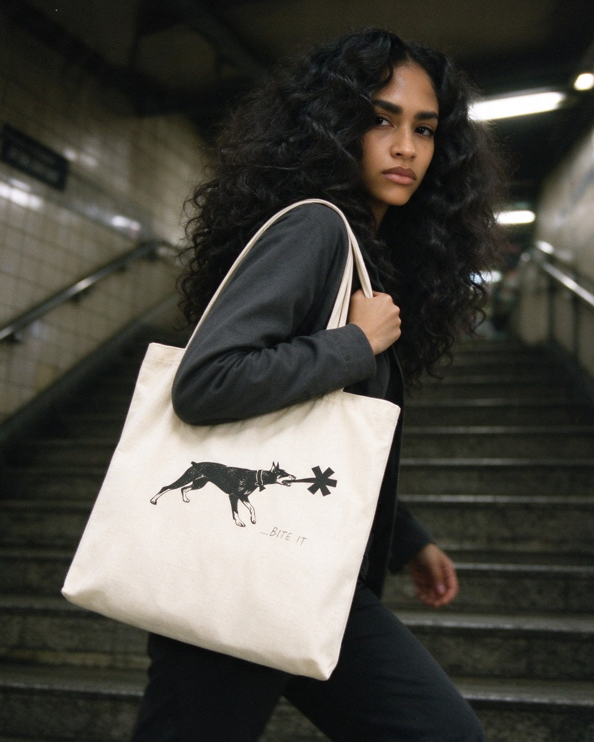 Dober Bite Tote Bag worn on the street — Urban Kong